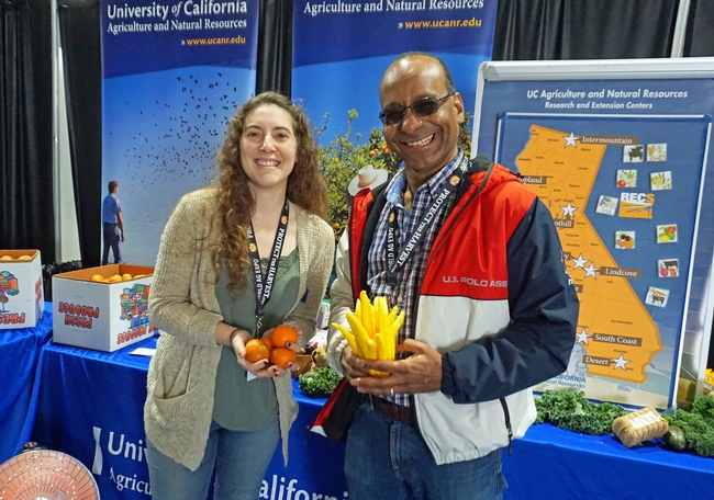 UC Cooperative Extension specialist Ashraf El-Kereamy helped staff the UC ANR booth, along with Stephanie Doria.