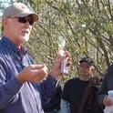 Walt Bentley speaks to growers at a field day.