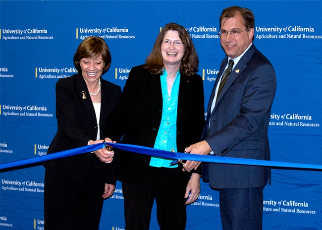From left, California Department of Food and Agriculture secretary Karen Ross, UC ANR VP Barbara Allen-Diaz and Davis Mayor Joe Krovoza cut the ribbon to new building.
