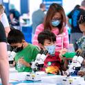 Children look into microscopes during North Bay Science Discovery Day, cosponsored by UC Cooperative Extension. Photo by Evett Kilmartin
