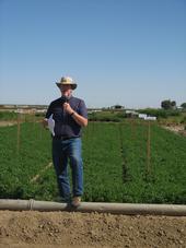 Dan Putnam discusses the importance of variety selection at an alfalfa field day.