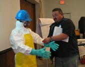 Participants work in groups to choose the appropriate personal protective equipment (PPE) for a given pesticide application task.