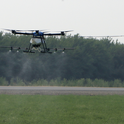 Photo 1. Drone application of pesticides for summer worm control in alfalfa hay.