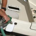 Catch drips with an absorbent “fuel bib” when you fuel your boat. Photo courtesy of BOAT US Foundation.