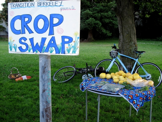 Painted sign entitled crop swap and table at Berkeley Transitions event