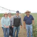 Fresno State professor Anil Shrestha (far right) with students at a research site.