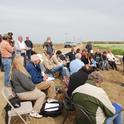 Farmers gather for training at a previous conservation agriculture field day. A half-day workshop titled 'Benefits of Soil Management for Farming Systems