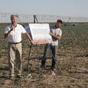 Jeff Mitchell presents research updates on a broccoli field with overhead irrigation.