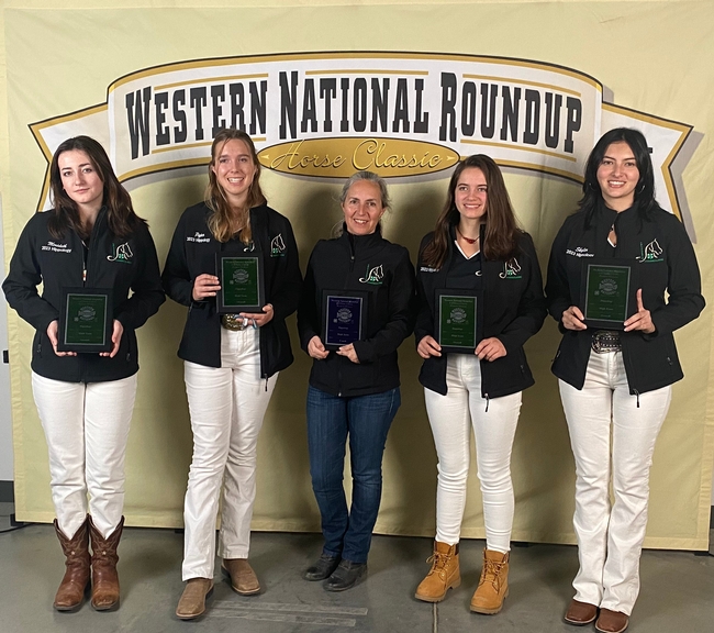 National Champion 4-H Hipoology Team-Western Region holding their plaques in front of the Western National Roundup sign