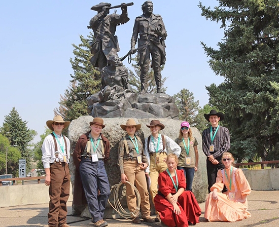 Multi state participants enjoy a moment in front of the Lewis and Clark statue on the banks of the Missouri River in Fort Benton, MT