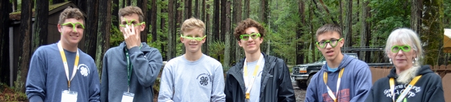 6 camp leaders with funny green glasses.