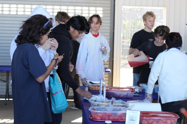 High school students taste a variety of fruits grown and harvested at the South Coast REC during a GROW field day. Photo by Saoimanu Sope.