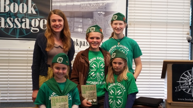 Author Kiera Butler poses at a book store in Corte Madera with 4-H members.