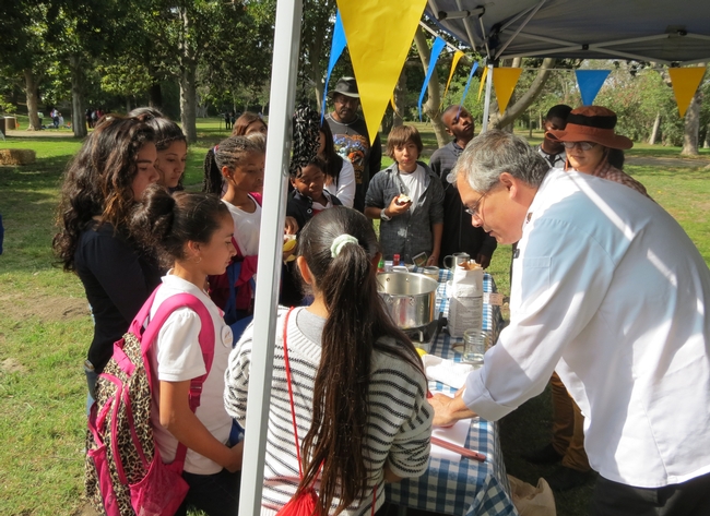 Ernest Miller and Hae Jung Cho teach students how to make strawberry jam at the UCCE LA County centennial celebration.