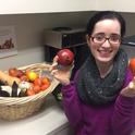 Ruchi Kashyap shows some of the fruits and vegetables in the $100 farmers market basket.
