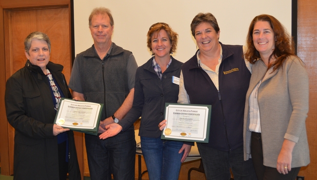 Mark Andre and Karen Diemer presented City of Arcata Forest carbon credits to Napolitano and Humiston to offset their travel.