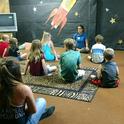 UC ANR staff member Margarita Alvord leads a yoga class for Trinity County youth.