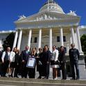 Mexican dignitaries and UC ANR 4-H leadership pose on the steps of the State Capitol after they accepted a resolution from the California State Senate recognizing their agreement to bring 4-H to Baja California.