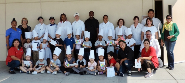 Community college student teachers with Preschoolers who received a certificate and chef's hat