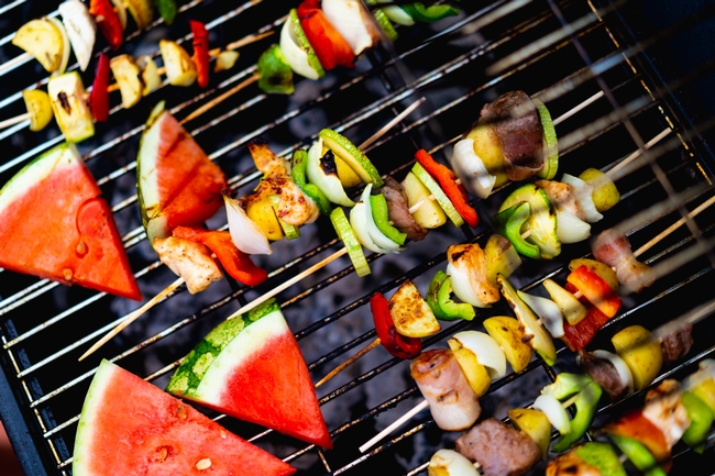 Dan Gold - Unsplash. Photo of vegetable and meat kebobs on a grill.
