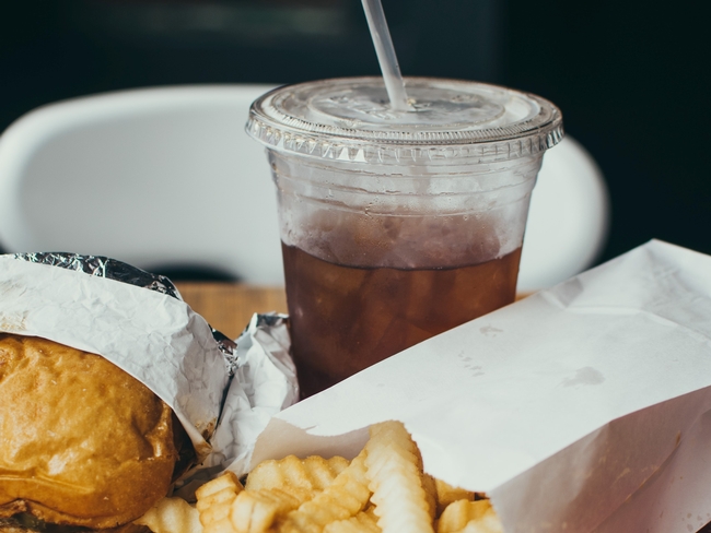 Soft drink with burger and fries