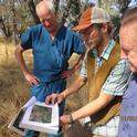 NRCS Soil scientist Andrew Brown (in cap) shows Tuolumne property owner Tim Moreno and Tuolumne Supervisor John Gray the soil map.