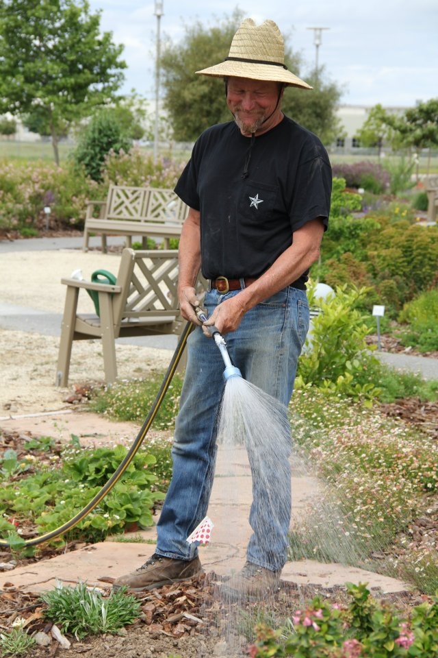 Master Gardeners earn volunteer hours working in the garden
