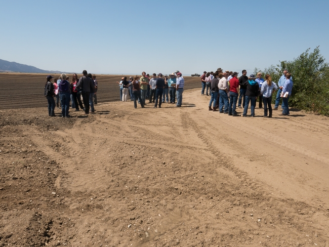 Comanagement  conference participants  discuss farming and conservation efforts at a diversified organic operation.