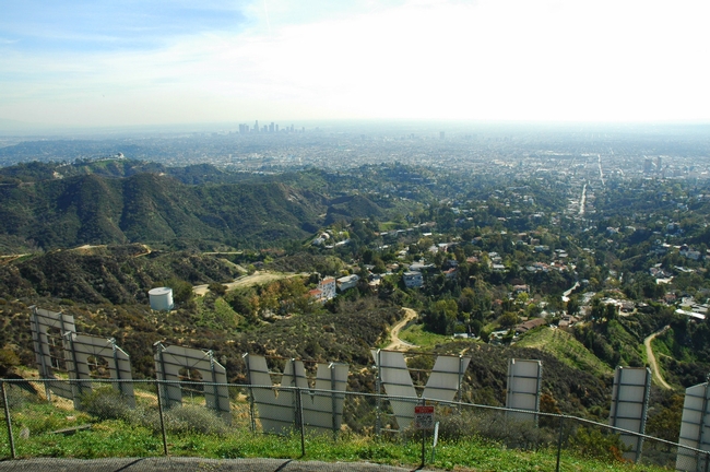 A hike to the Hollywood sign lends a far-off view of downtown beyond Griffith Park.