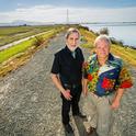 Professors and Delta Independent Science Board members Vincent Resh (right) and Richard Norgaard stand on a levee on Sherman Island along the Sacramento River. (Photo: Edward Caldwell)