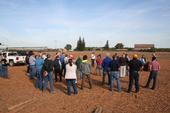 Farmers and industry professionals gather at a UC Cooperative Extension field day at the Tellarico Farm in Manteca, Calif.
