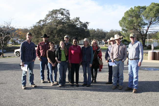 Ranchers pose with Rebecca Ozeran, UCCE livestock advisor in Fresno and Madera Counties (green blouse), and Fadzayi Mashiri, UCCE livestock advisor for Mariposa and Merced counties (red sweater.)