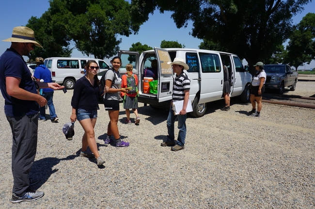 Traveling in two vans, 10 students, a teachers assistant and two professor are following the course of California water.