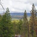 Dead trees can be seen in the foreground and on the distant mountain side. (Click on photos for higher resolution.)