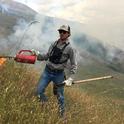 Shapero demonstrates prescribed burn. Since the Thomas Fire, prescribed fire has become more accepted as a technique to reduce vegetation and lessen the threat of catastrophic wildfire. Photo by by Robert Acquistapace
