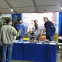 Computer resource specialist Robert Johnson, assistant program and facility coordinator Julie Sievert and KARE director Jeff Dahlberg answer questions at the KARE booth in Pavilion A.