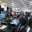 SRAs Brady Holder and Lauren Vuicich provide information from the Kearney booth at World Ag Expo.