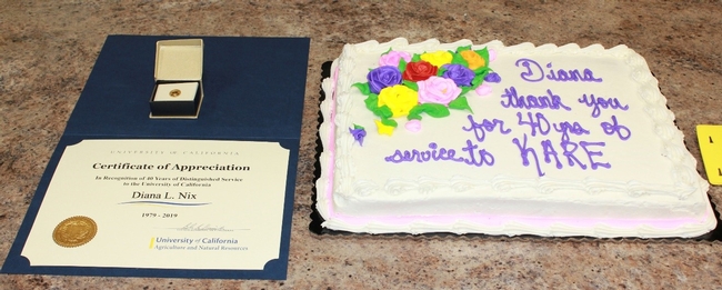 Certificate, 40 year pin, and cake to mark the occasion.