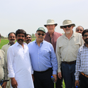 Dr.Khaled Bali (green hat), Dr.Dan Putnam (center back), and Dr.Jeff Dahlberg (tan hat and shirt) meeting with Pakistani improved forage stakeholders.