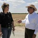 Freelance reporter Cecelia Parsons, left, talks blueberries with UCCE farm advisor Manuel Jimenez.