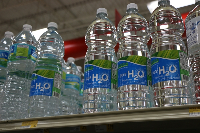 Image of bottled water on a store shelf from Pixabay.