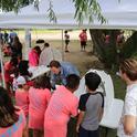 Campers learn from UC scientists at one of the river education stations.