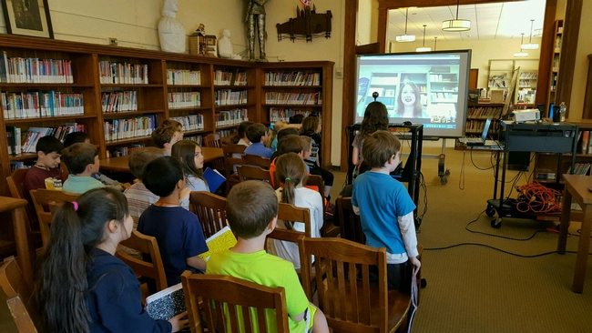 Students congregated in the school library video conference with Elizabeth Fichtner.