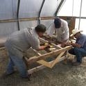 Gerry, Jose T. and Jose H. make improvements in the benches