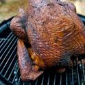 Delectable smoked turkey on a grill.