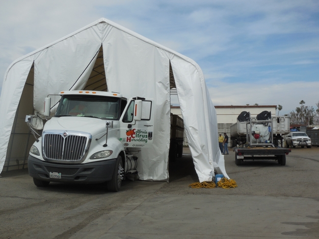 Semi-truck leaves the load in the portable fumigant tent