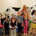 Judy Ludovice with junior farmers and Clarabelle the Cow