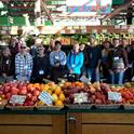 Local farmers tour Sebastopol’s Community Market during a UCCE Tour to Meet Buyers in December