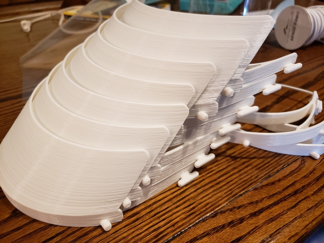 3D printed masks showing the visors, before the shields have been added.