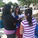 Consuelo Cid teaches a family at Burroughs Elementary about a Healthy Plate.